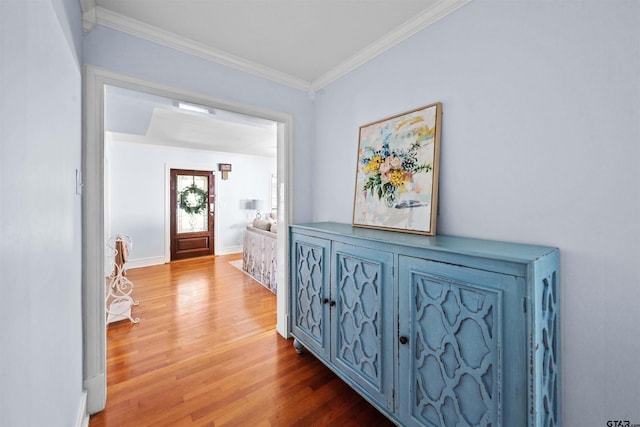 corridor featuring hardwood / wood-style flooring and crown molding