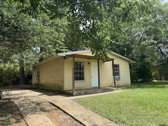 330 Randolph St, Lone Star, TX 75668 - view of front of property featuring a front lawn and cooling unit