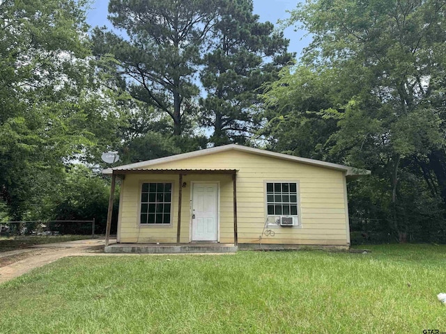 330 Randolph St, Lone Star, TX 75668 - view of front facade featuring a front lawn and cooling unit