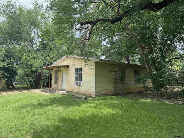 330 Randolph St, Lone Star, TX 75668 - view of home's exterior with a yard and cooling unit
