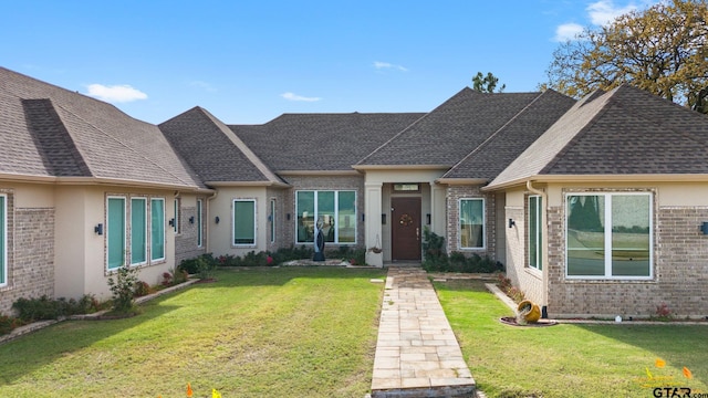 view of front of home with a front lawn