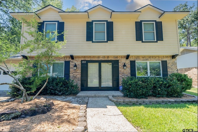 view of front of home with brick siding