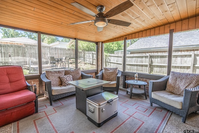 sunroom with outdoor lounge area, ceiling fan, and a healthy amount of sunlight