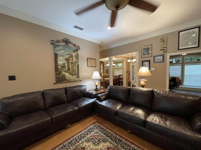3617 Flagstone Dr, Tyler, TX 75707 - living area featuring ornate columns, a ceiling fan, wood finished floors, a chandelier, and ornamental molding