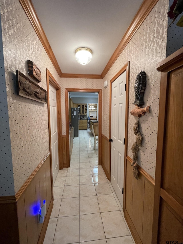 3617 Flagstone Dr, Tyler, TX 75707 - hall featuring ornamental molding, a wainscoted wall, wallpapered walls, and light tile patterned floors