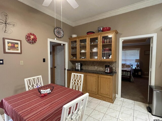 3617 Flagstone Dr, Tyler, TX 75707 - dining space with light tile patterned floors, crown molding, a ceiling fan, and light colored carpet