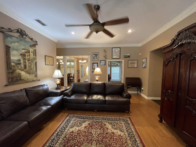 3617 Flagstone Dr, Tyler, TX 75707 - living area with a ceiling fan, wood finished floors, a chandelier, decorative columns, and ornamental molding