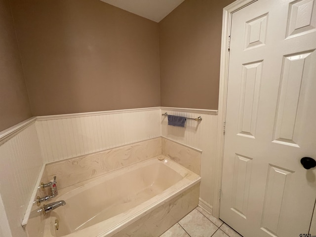 3617 Flagstone Dr, Tyler, TX 75707 - full bath featuring a bath, wainscoting, and tile patterned floors