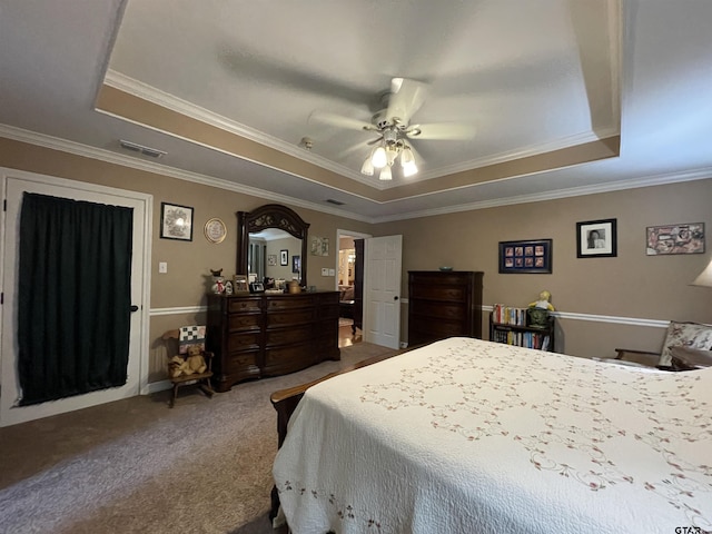 3617 Flagstone Dr, Tyler, TX 75707 - carpeted bedroom with a tray ceiling, ornamental molding, and ceiling fan