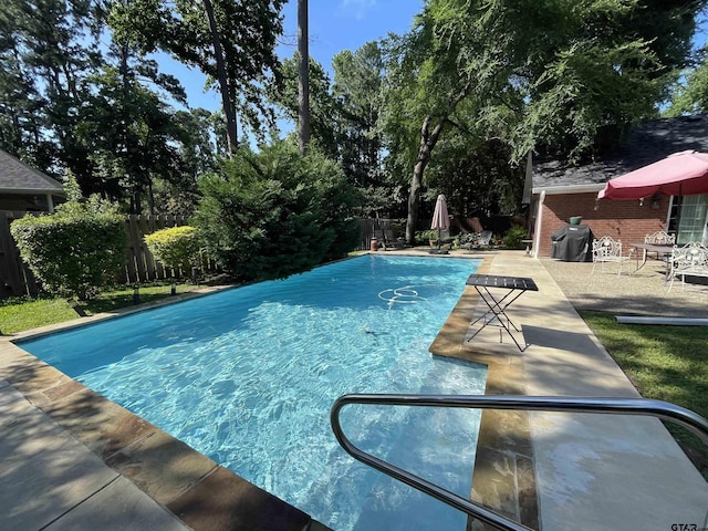 3617 Flagstone Dr, Tyler, TX 75707 - view of swimming pool featuring a fenced backyard, a patio area, and grilling area