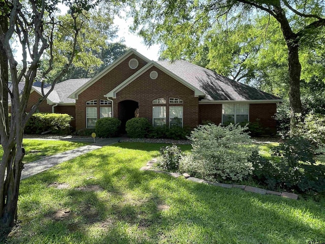 3617 Flagstone Dr, Tyler, TX 75707 - view of front of home featuring brick siding and a front lawn