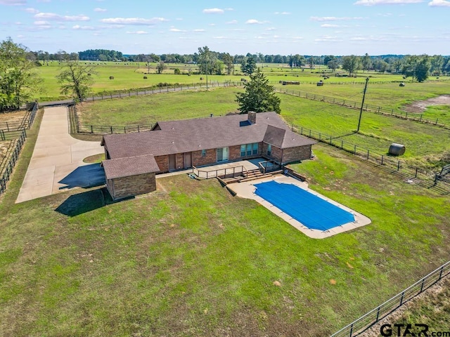 birds eye view of property with a rural view