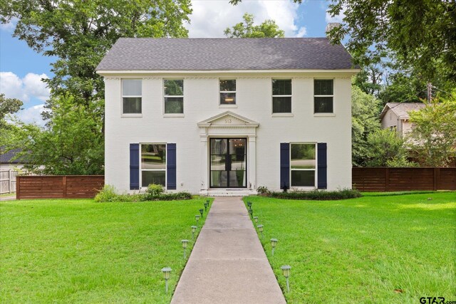 513 E Young, Longview, TX 75602 - colonial home featuring brick siding and roof with shingles