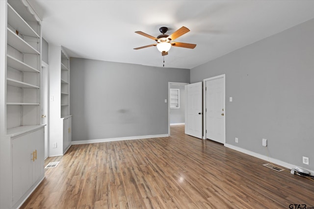 513 E Young, Longview, TX 75602 - unfurnished bedroom with light wood finished floors and a ceiling fan
