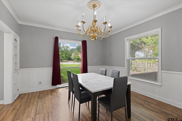 513 E Young, Longview, TX 75602 - dining room with a chandelier, a wainscoted wall, wood finished floors, and ornamental molding