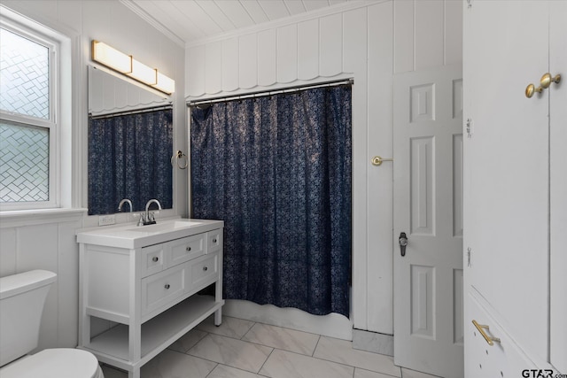 513 E Young, Longview, TX 75602 - full bathroom featuring vanity, ornamental molding, and a shower with curtain
