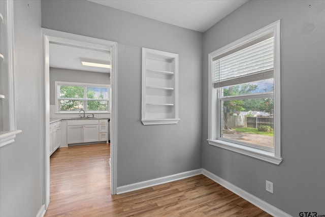 513 E Young, Longview, TX 75602 - unfurnished room featuring light wood-style flooring and a sink