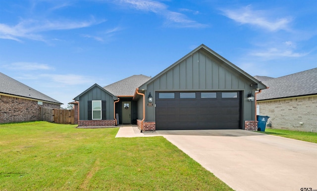 view of front of property featuring brick siding, board and batten siding, a front yard, a garage, and driveway