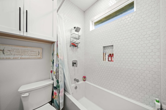 full bathroom with toilet and shower / tub combo with curtain