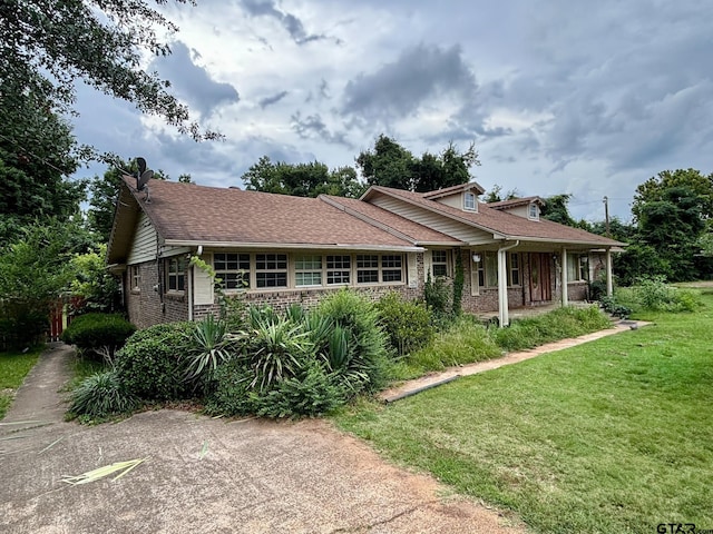 400 Dorsey St, Linden, TX 75563 - view of front facade featuring brick siding and covered porch