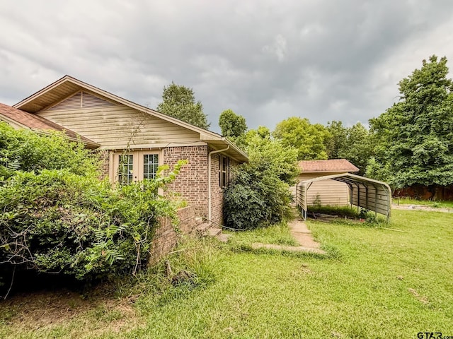 400 Dorsey St, Linden, TX 75563 - view of grassy yard with a detached carport