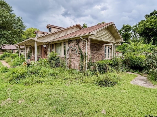 400 Dorsey St, Linden, TX 75563 - view of side of property with a yard and brick siding
