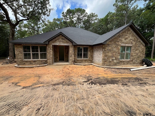14664 Jade Forest Trl, Tyler, TX 75707 - view of front of house featuring stone siding and roof with shingles