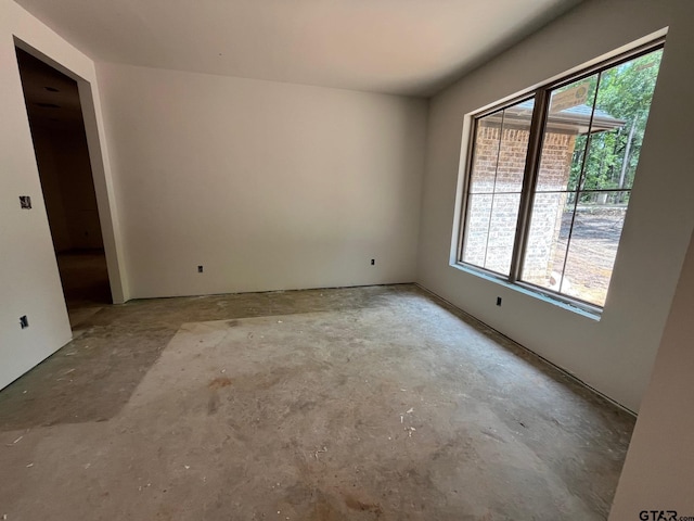 14664 Jade Forest Trl, Tyler, TX 75707 - spare room with concrete floors and healthy amount of natural light