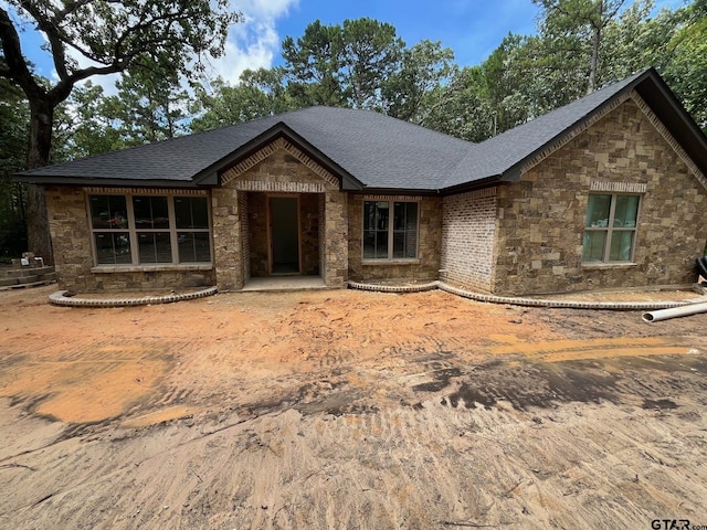 14664 Jade Forest Trl, Tyler, TX 75707 - view of front of house with stone siding and a shingled roof