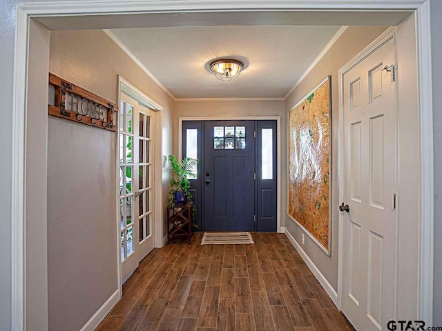 foyer with dark hardwood / wood-style flooring and ornamental molding