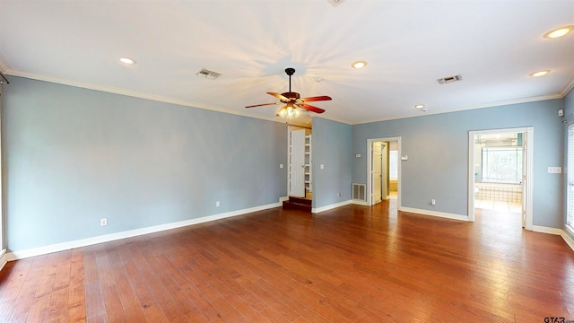 unfurnished room with ceiling fan, wood-type flooring, and crown molding