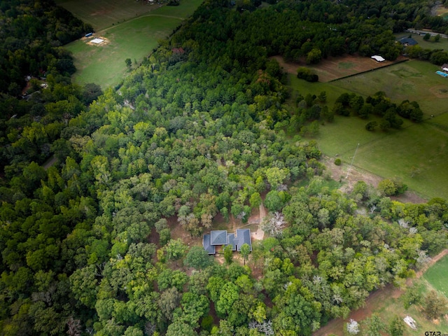 birds eye view of property with a rural view