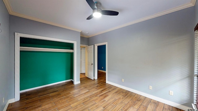 unfurnished bedroom featuring a closet, light hardwood / wood-style floors, ceiling fan, and ornamental molding