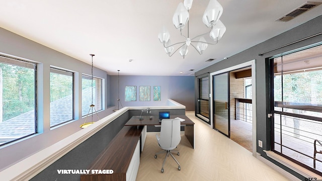 office area featuring a notable chandelier and plenty of natural light