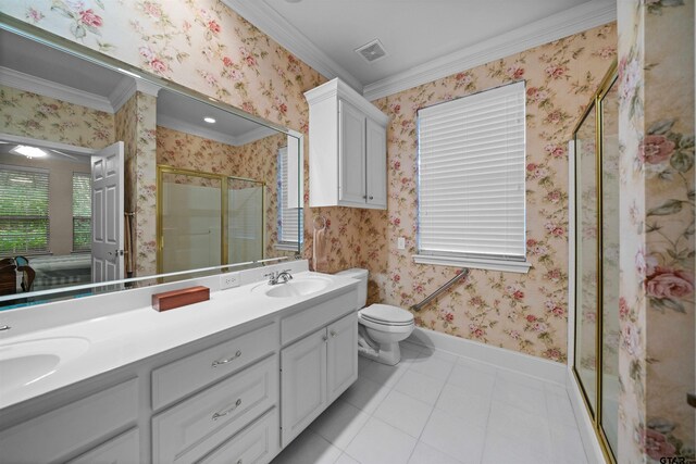 5810 Hollybrook Dr, Tyler, TX 75703 - full bathroom with tile patterned floors, crown molding, a stall shower, wallpapered walls, and double vanity