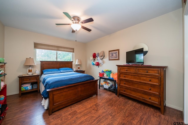 bedroom featuring dark hardwood / wood-style flooring and ceiling fan