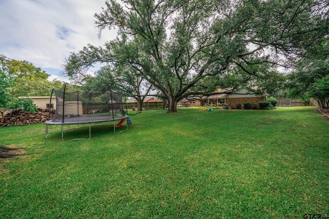 1413 S Main St, Lindale, TX 75771 - view of yard featuring a trampoline