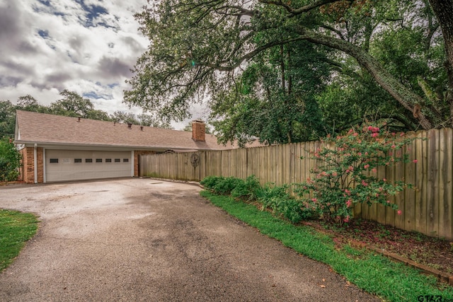 view of yard with a garage