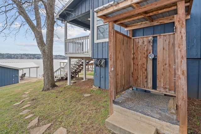 view of side of home featuring a yard