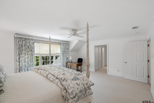 carpeted bedroom featuring ceiling fan and crown molding