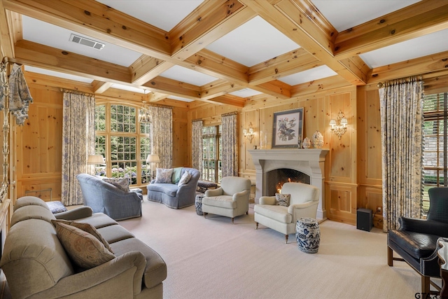 living room with wood walls, beam ceiling, light carpet, and coffered ceiling