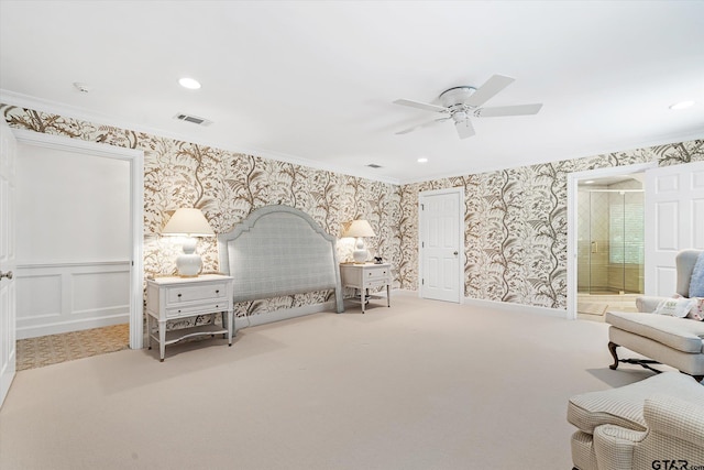 bedroom featuring ensuite bathroom, ceiling fan, crown molding, and carpet