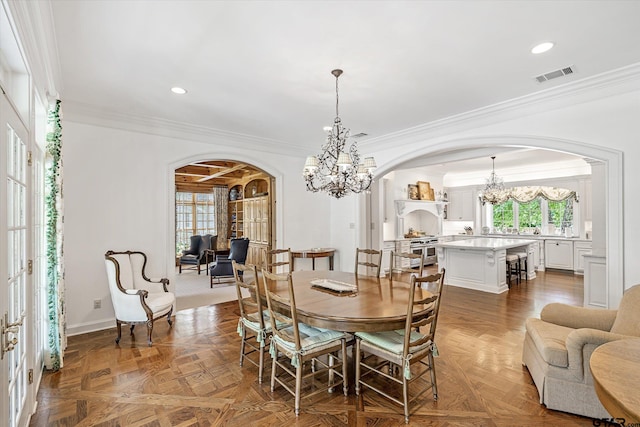 dining room with parquet floors and crown molding