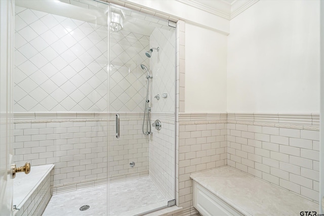 bathroom featuring tile walls, walk in shower, and crown molding