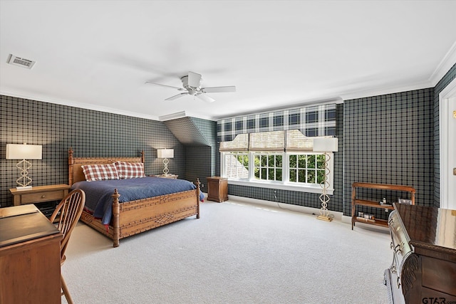 bedroom featuring carpet flooring, ceiling fan, and crown molding