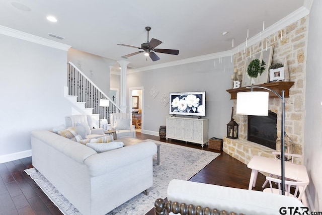 521 Susie St, Chandler, TX 75758 - living area featuring a ceiling fan, crown molding, stairway, a stone fireplace, and wood finished floors