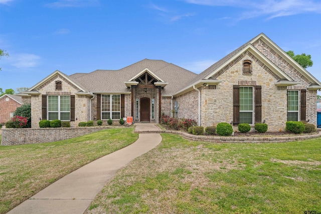 521 Susie St, Chandler, TX 75758 - view of front of house featuring a front lawn, stone siding, and brick siding