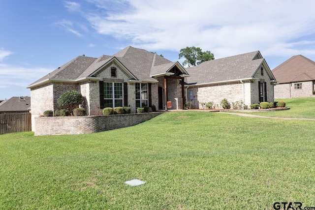 521 Susie St, Chandler, TX 75758 - french country home featuring brick siding and roof with shingles