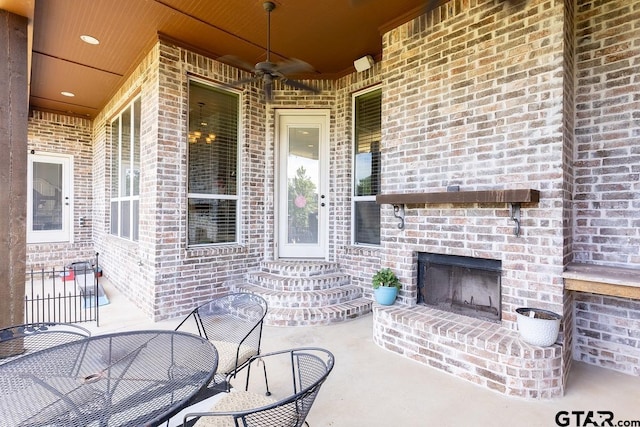 521 Susie St, Chandler, TX 75758 - view of patio / terrace featuring an outdoor brick fireplace, a ceiling fan, and entry steps