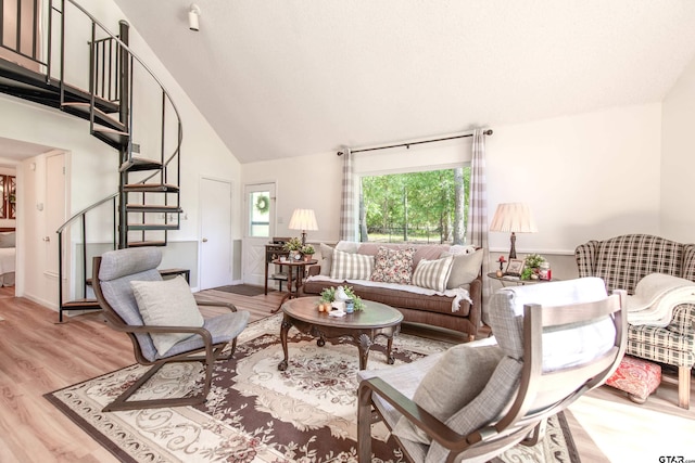 506 S King Lake Rd, Scroggins, TX 75480 - living room featuring stairs, light wood finished floors, and high vaulted ceiling